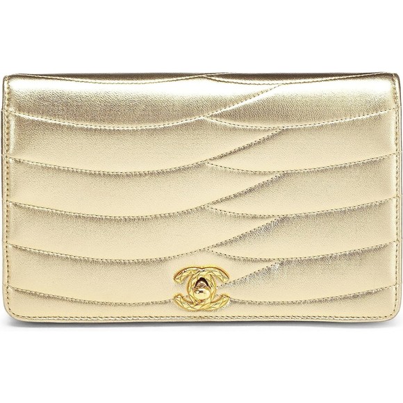 CHANEL Handbags - CHANEL Gold Quilted Lambskin Clutch